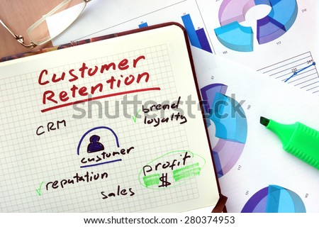Notepad with words customer retention  concept and marker.