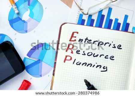 Notepad with words ERP enterprise resource planning  concept and marker.