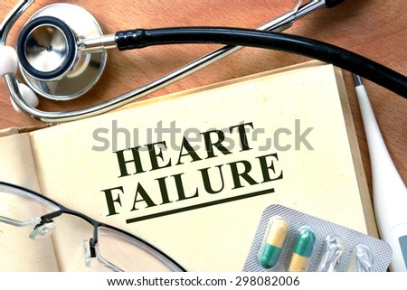 Heart failure concept. Books with stethoscope and.