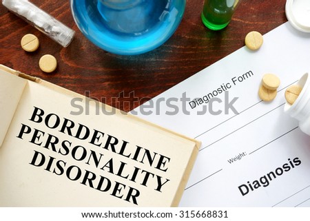 borderline personality disorder  written on book with tablets. Medicine concept.