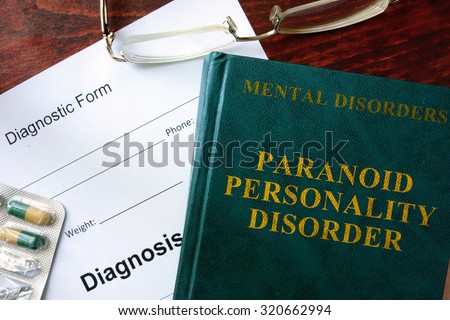 Paranoid personality disorder  concept. Diagnostic form and book on a table.