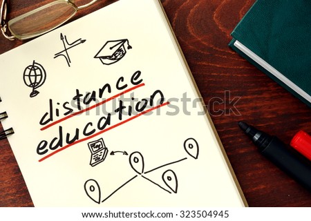 Words distance education written in the notepad.