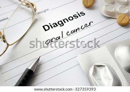 Diagnosis oral cancer written in the diagnostic form and pills.