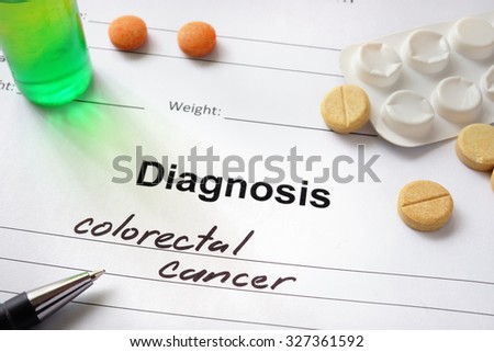 Diagnosis colorectal cancer written in the diagnostic form and pills.