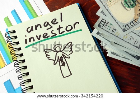 Notebook with angel investor  sign.  Business concept.