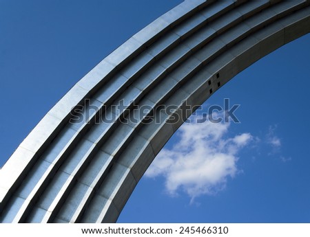 A metal arch on the sky background