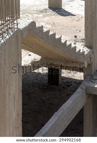 ladder on a construction site covered with dust and debris