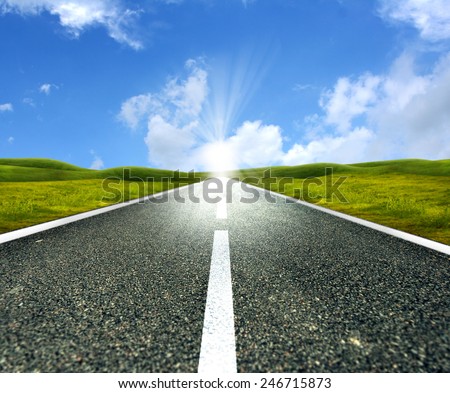 Empty asphalt road towards bright sun