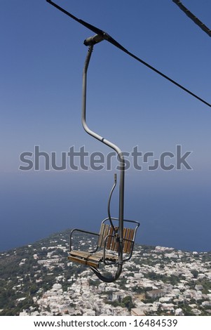 A chairlift on it\'s way up to Monte Salero overlooking Anacapri.