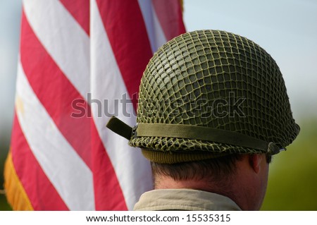 US army helmet of the second world war near a United States of America flag. Picture taken during a commemorative fest about the liberation of Europe