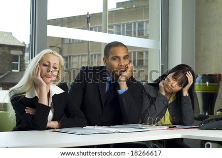 Business meeting in a modern office with everyone bored