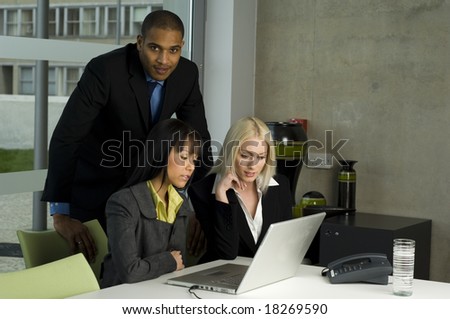 Business meeting in a modern office with everyone smiling