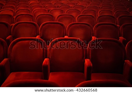 Rows of empty cinema or theater red seats