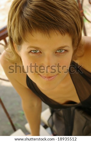 Attractive young woman with sly smile