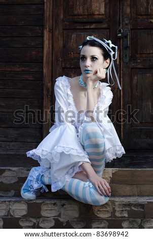 Young sad girl with Sweet Lolita looking