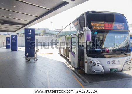 Taipei, Taiwan - November 23, 2014: An airport city bus is parked at the airport bus terminal at Taoyuan airport in Taoyuan County.