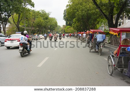 Hanoi, Vietnam - April 13, 2014: Traffic in Dinh Tien Hoang str, Hanoi, Vietnam