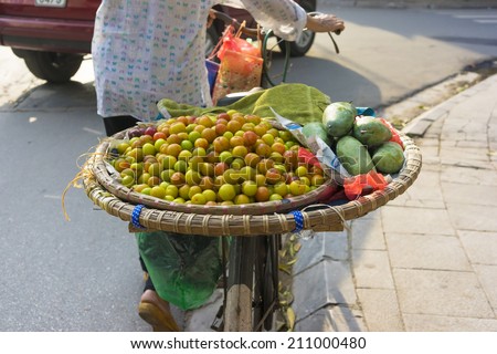 Basket of fruits on bike for selling on Hanoi street