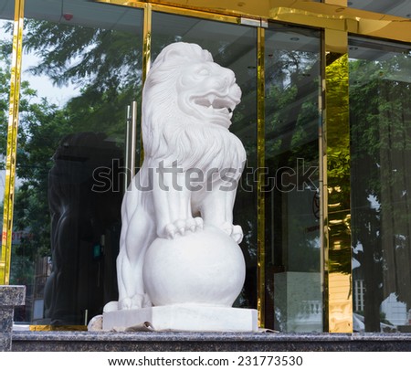 Hanoi, Vietnam - Nov 16, 2014: Stone lion, the animal usually seen on entrance of business building in oriental culture