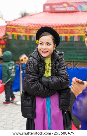 Hanoi, Vietnam - Feb 7, 2015: Portrait of woman Puppetry at break time before next puppetry show at Vietnamese lunar new year festival organized at Vinschool, Vinhomes Times City, Minh Khai