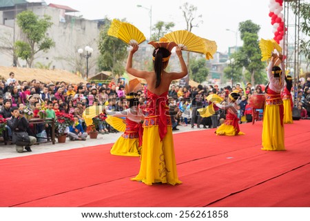 Hanoi, Vietnam - Feb 7, 2015: School pupils perform a dance on stage at Vietnamese lunar new year festival organized at Vinschool, Vinhomes Times City, Minh Khai