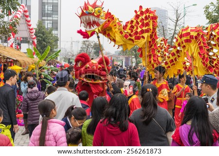 Hanoi, Vietnam - Feb 7, 2015: A show of lion and dragon dance at Vietnamese lunar new year festival organized at Vinschool, Vinhomes Times City, Minh Khai street