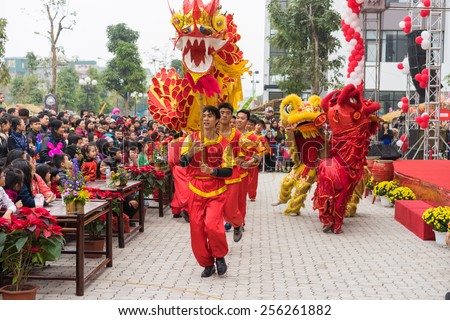 Hanoi, Vietnam - Feb 7, 2015: A show of lion and dragon dance at Vietnamese lunar new year festival organized at Vinschool, Vinhomes Times City, Minh Khai street