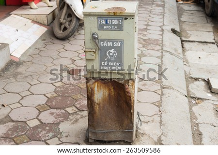 Hanoi, Vietnam - Mar 15, 2015: Damaged old electrical cabinet on Tay Son street.