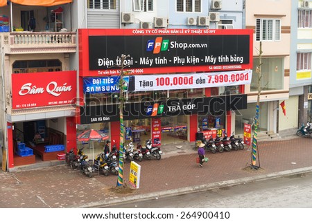 Hanoi, Vietnam - Mar 15, 2015: Front view of a high technology store of FPT Telecom in Xa Dan street in Hanoi capital. FPT is one of the biggest technology groups in Vietnam.