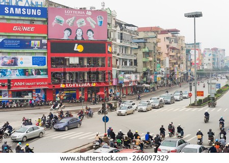Hanoi, Vietnam - Mar 15, 2015: Low aerial view of Hanoi traffic in Xa Dan street. Vehicles stopping at traffic light