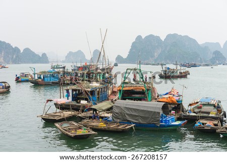 Quang Ninh, Vietnam - Mar 22, 2015: Fishing village in Bai Tu Long bay, next to Ha Long bay. Many people with their family doing trading and fishing on boat