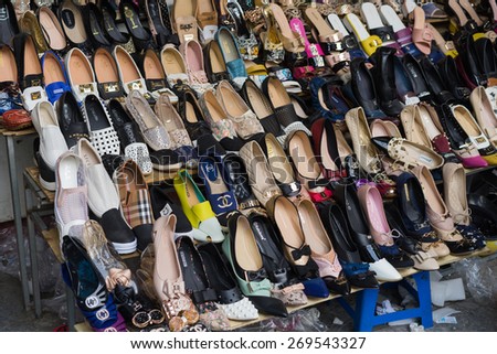 Hanoi, Vietnam - Apr 5, 2015:  Various type of woman shoes for sale on a store in Hanoi