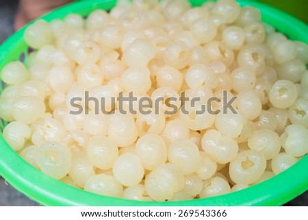 Basket of processed longan fruit with skin removed