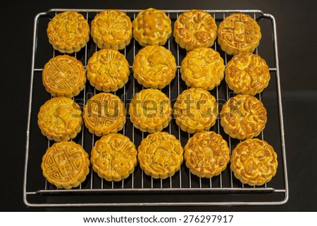 Vietnamese mid autumn festival cake. Mooncakes are traditional pastries eaten during the Mid-Autumn Festival. The festival involves family getting together to share mooncakes while watching the moon
