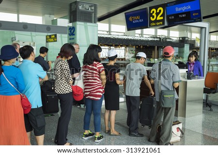 Hanoi, Vietnam - June 26, 2015: Lines of people waiting at boarding gate in Noi Bai International Airport