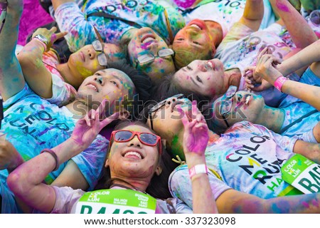 Hanoi, Vietnam - Sep 23, 2015: Group of teenagers taking photo at public color run event in Hanoi capital city. Hundreds of people joined the joyful race named \