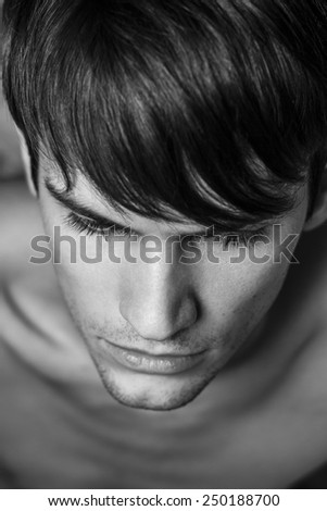 Close up of male head shot. Black and white portrait. Top view.