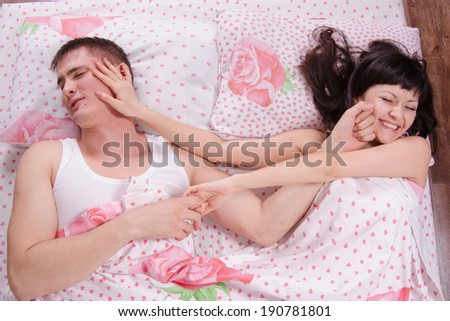 Young couple find out the relationship in bed