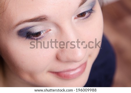 Portrait of beautiful girl with bright makeup, makeup process