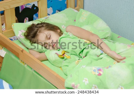 six year old girl Europeans sleeping in her bed