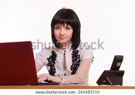 Portrait of a call-center employee in front the monitor