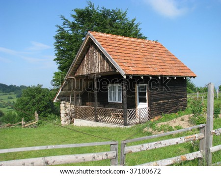 a little rustic log cabin in the woods