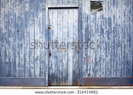 Blue peeling paint door background