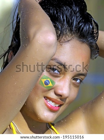 Beautiful Woman with Brazil Flag on Face