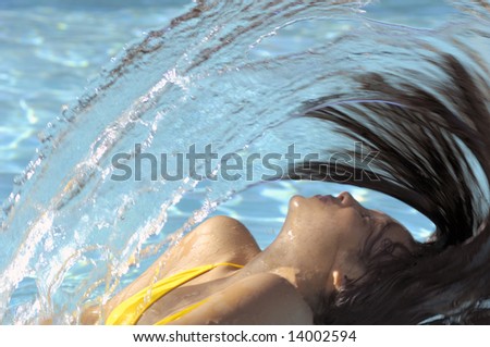 Woman Splashing Hair on Water