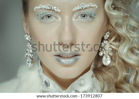 Beautiful girl dressed as the image of the Snow Queen