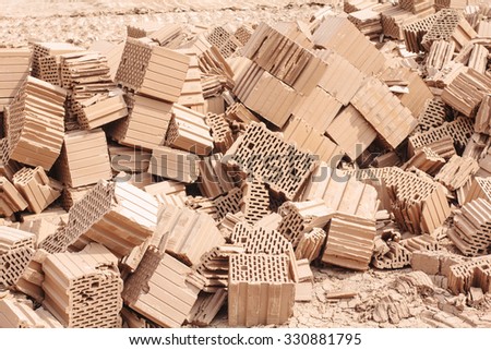 Pile of broken clay raw brick at the factory