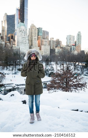 Beautiful lady in a cold city.