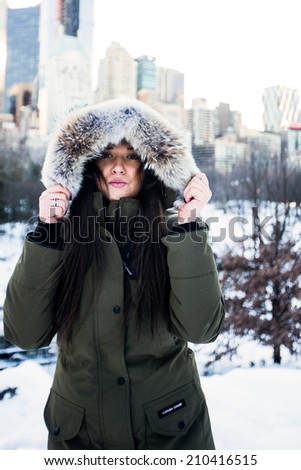 Beautiful lady in a cold city.