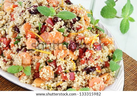Citrus Couscous Salad with orange zest, carrots,  red bell pepper, dried cranberries and fresh mint.